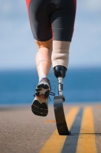 4470785-an-athlete-with-a-prosthetic-leg-running-down-the-road-towards-the-ocean